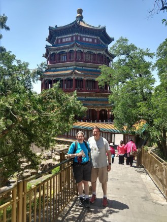 Me and Ed, in front of the Tower of Buddhist Incense, a tall, fancy building.