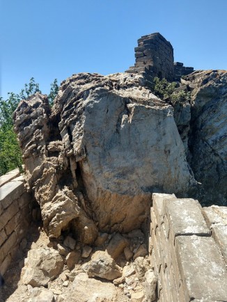 It looks like a giant rock has fallen onto the wall, blocking it.