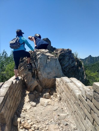 Crystal and Linda, climbing over the rock.