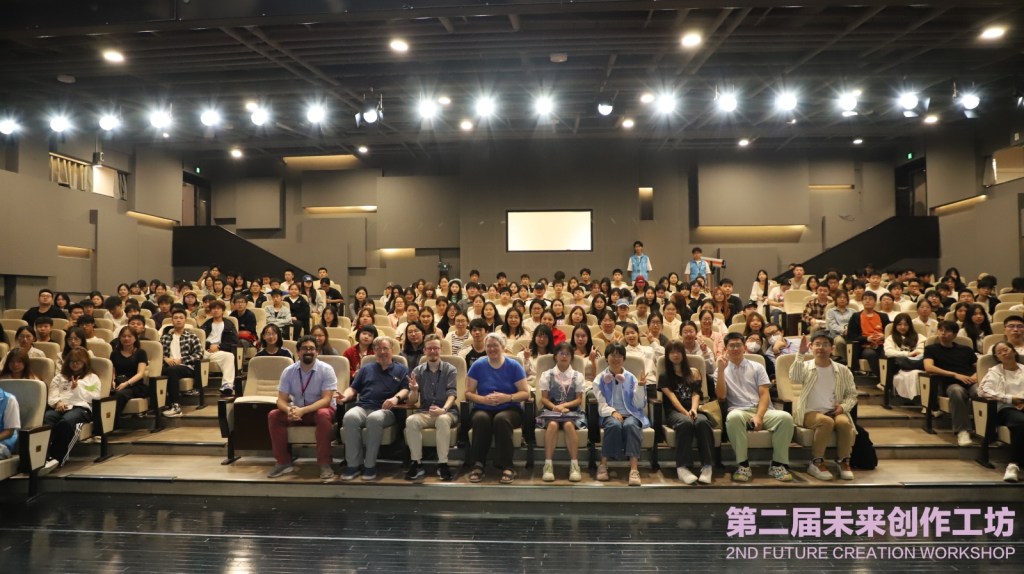 An auditorium full of Chinese students, except for four people in the front row (me, Roderick, Jim, and Leo.)