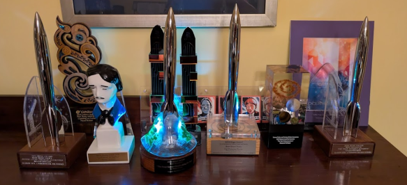 Four Hugos; an Edgar Award; a Nebula Award; a Lodestar Award; two Fishing Fortress Science Fiction Awards (those are a Chinese award); a Locus Award; a WSFA Small Press Award; a print of the cover of the Locus magazine that featured me; a set of "author cards" from McSweeneys that included me (they look like baseball cards.)